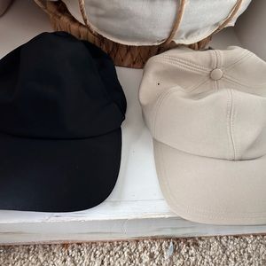 Black and cream colored lightweight running hats